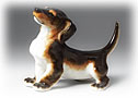 This happy little Lomonosov porcelain Dachshund figurine depicts the good nature typical of these short-legged pups.