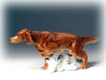 This big, red Irish Setter figurine stands in pointer position, ready to flush a pheasant in the field.