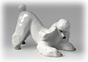 This all-white Lomonosov porcelain standard Poodle figurine demonstrates the classic doggie play bow. 