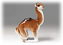 Do you ever dream of camel riding in Mongolia?   If so, you will like this young brown and white Camel figurine. 