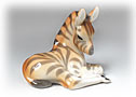   Do you have Zebra wallpaper or framed Zebra wall art?  If so, you will love this porcelain Zebra baby.  