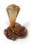 True to many Cobra images, this snake figurine's body is coiled, making it easy for him to stand upright.  