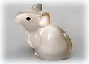 Would you like a house mouse? This cute little mouse figurine is looking for some cheese. 