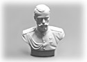 This figurine of Nicholas II The Second is dressed in a royal military coat and sports a distinguished, curled mustache.