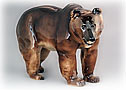 Like any story bear, this Mama Bear figurine seems to be growling, warning “Stay away from my cub!”