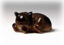 This little brown Bear Cub figure is sweetly sleeping the afternoon away, making a pretty picture of a brown bear. 
