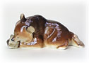 Happy in his honeycomb nook, this Bear With Honeycomb figurine is cute and humorous. 