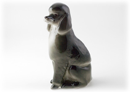 Buy Фарфоровая статуэтка "Пудель" (черный сидящий) at GoldenCockerel.com