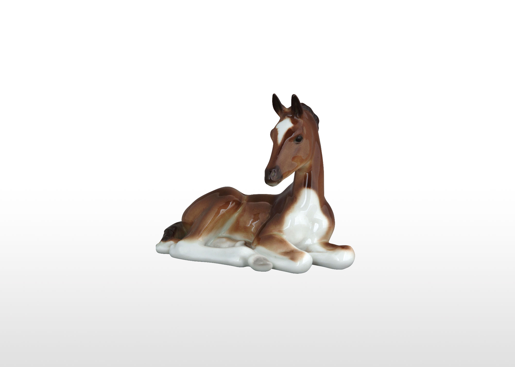 Buy Bay Foal Lying Figurine at GoldenCockerel.com
