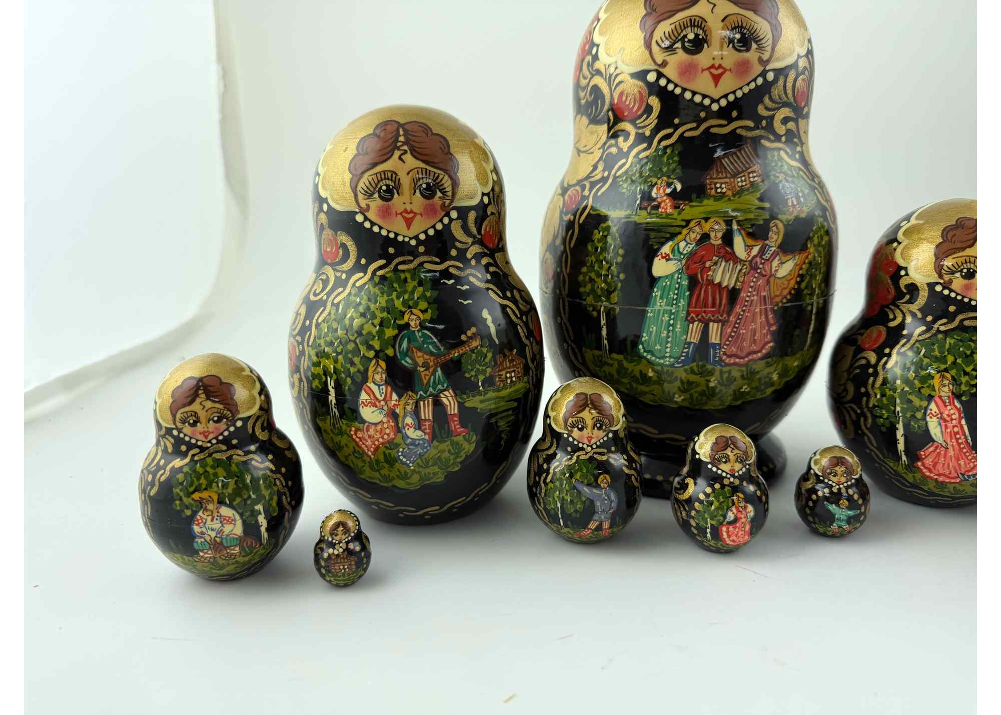 Buy Vintage Black and Gold Folk Scene Nesting Doll 10pc/9" at GoldenCockerel.com