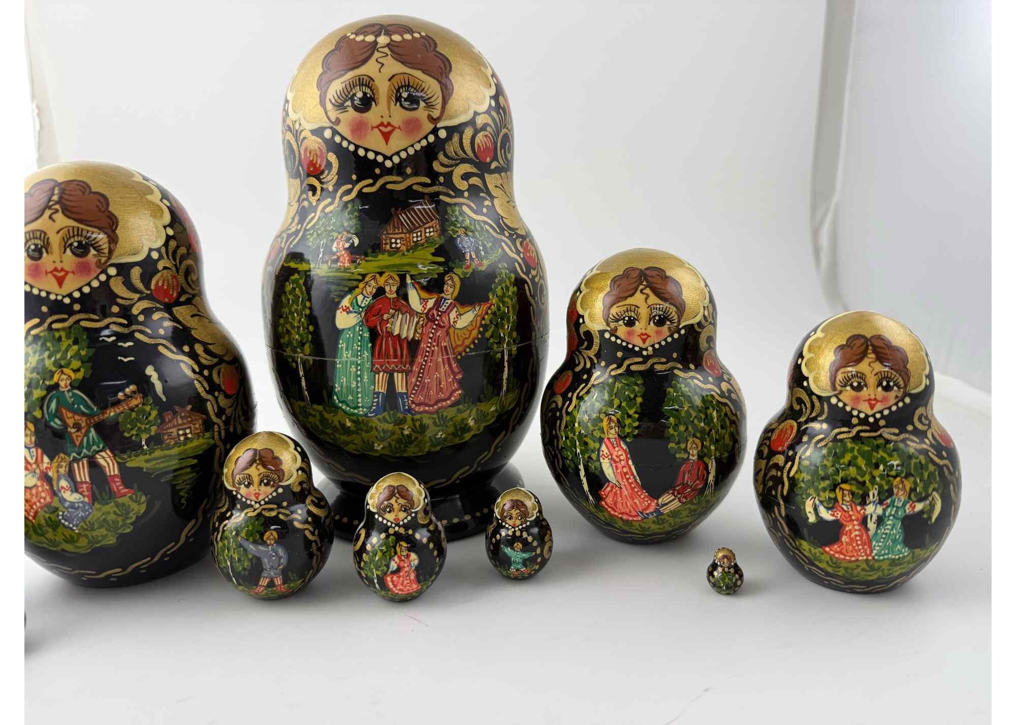 Buy Vintage Black and Gold Folk Scene Nesting Doll 10pc/9" at GoldenCockerel.com