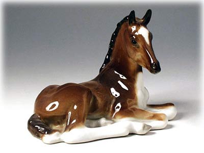Buy Bay Foal Lying Figurine at GoldenCockerel.com